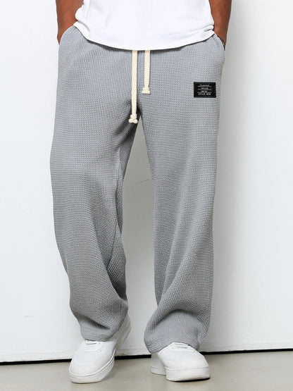 SAMUEL | PANTALONI LARGHI CON VITA REGOLABILE